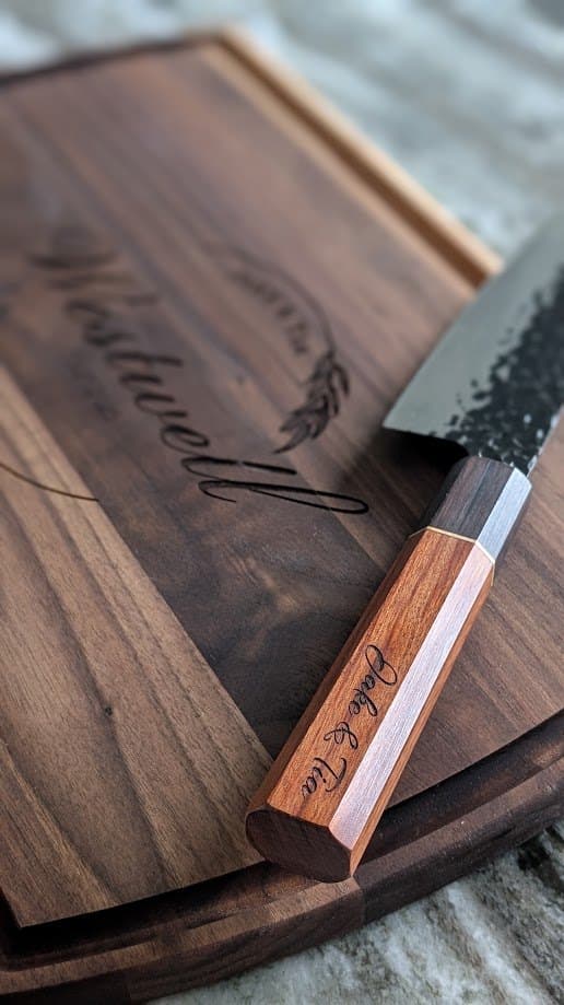 Engraved walnut cutting board with a personalized rosewood-handled knife